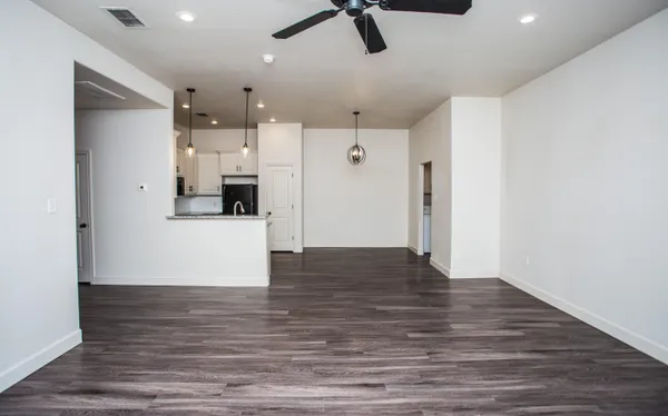 a view of a kitchen with a refrigerator and a cabinets