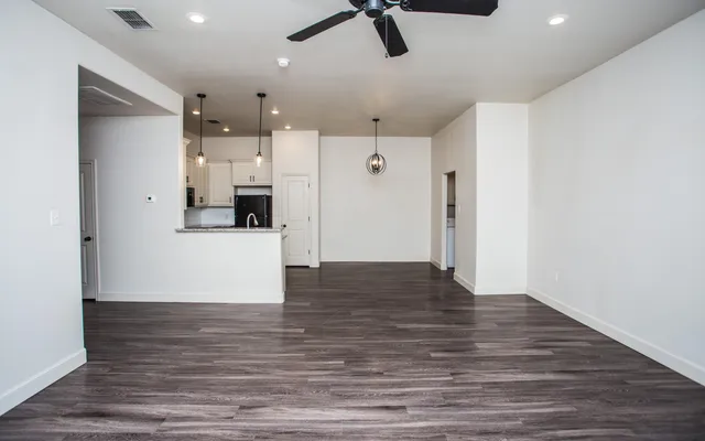 a view of a kitchen with a refrigerator and a cabinets