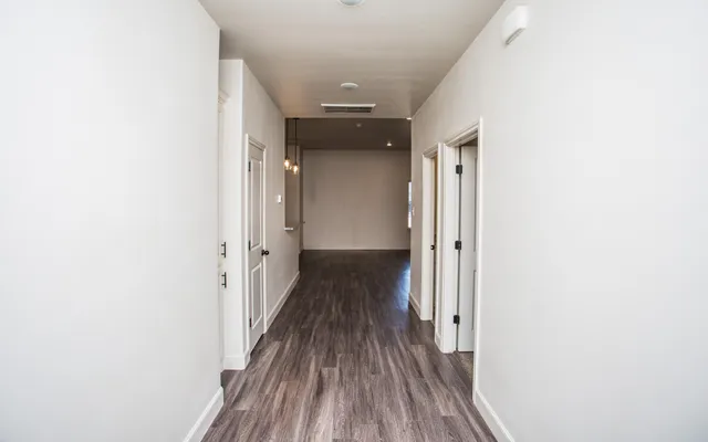 a view of an empty room and fire place