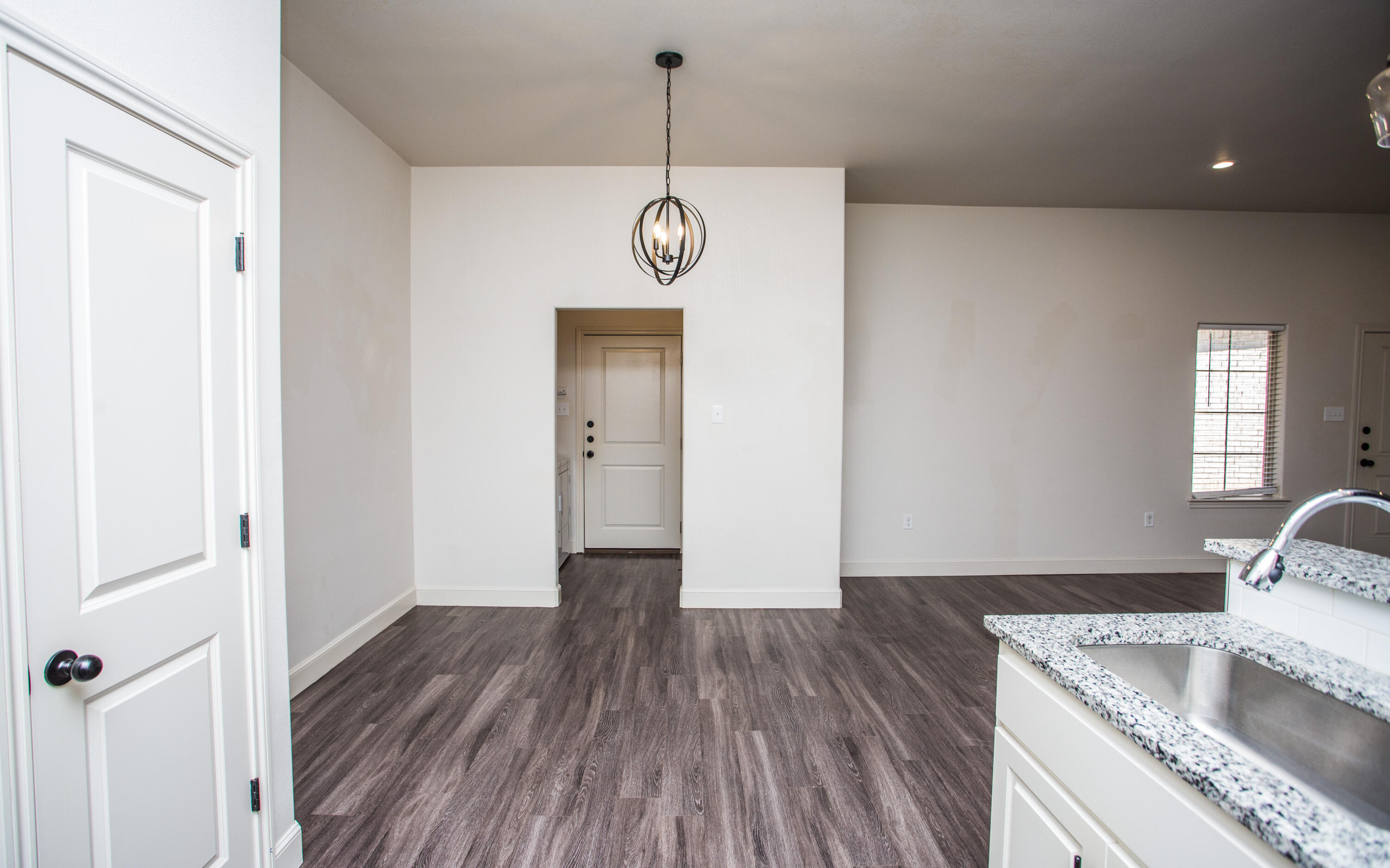 5520 Lehigh Street Lubbock, TX 79416 - Photo 4 of 32 a area with wooden floor and window