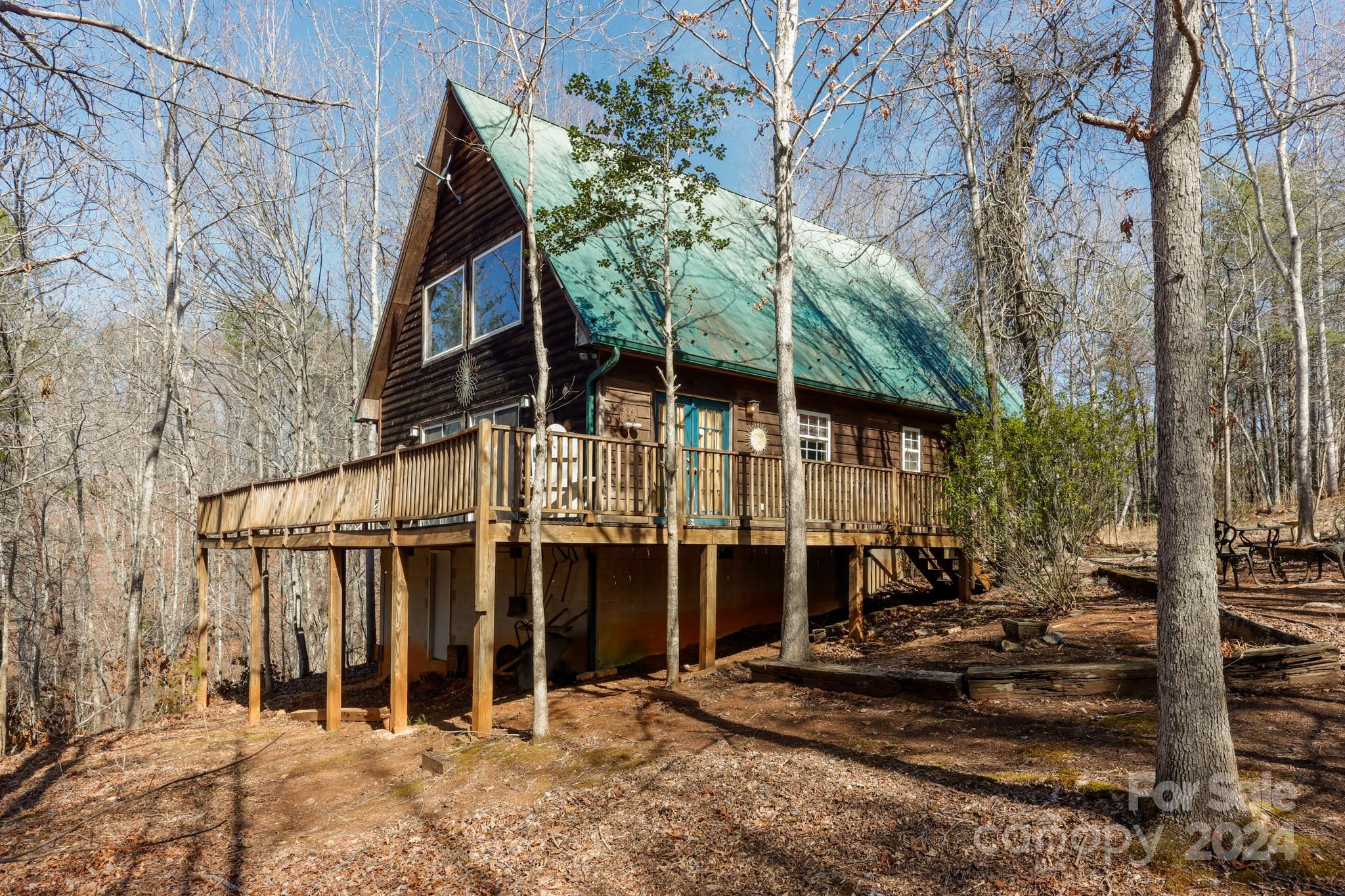 43 Goldfinch Ln Mill Spring Mill Spring, NC 28756 - Photo 1 of 32 a view of a house with a yard