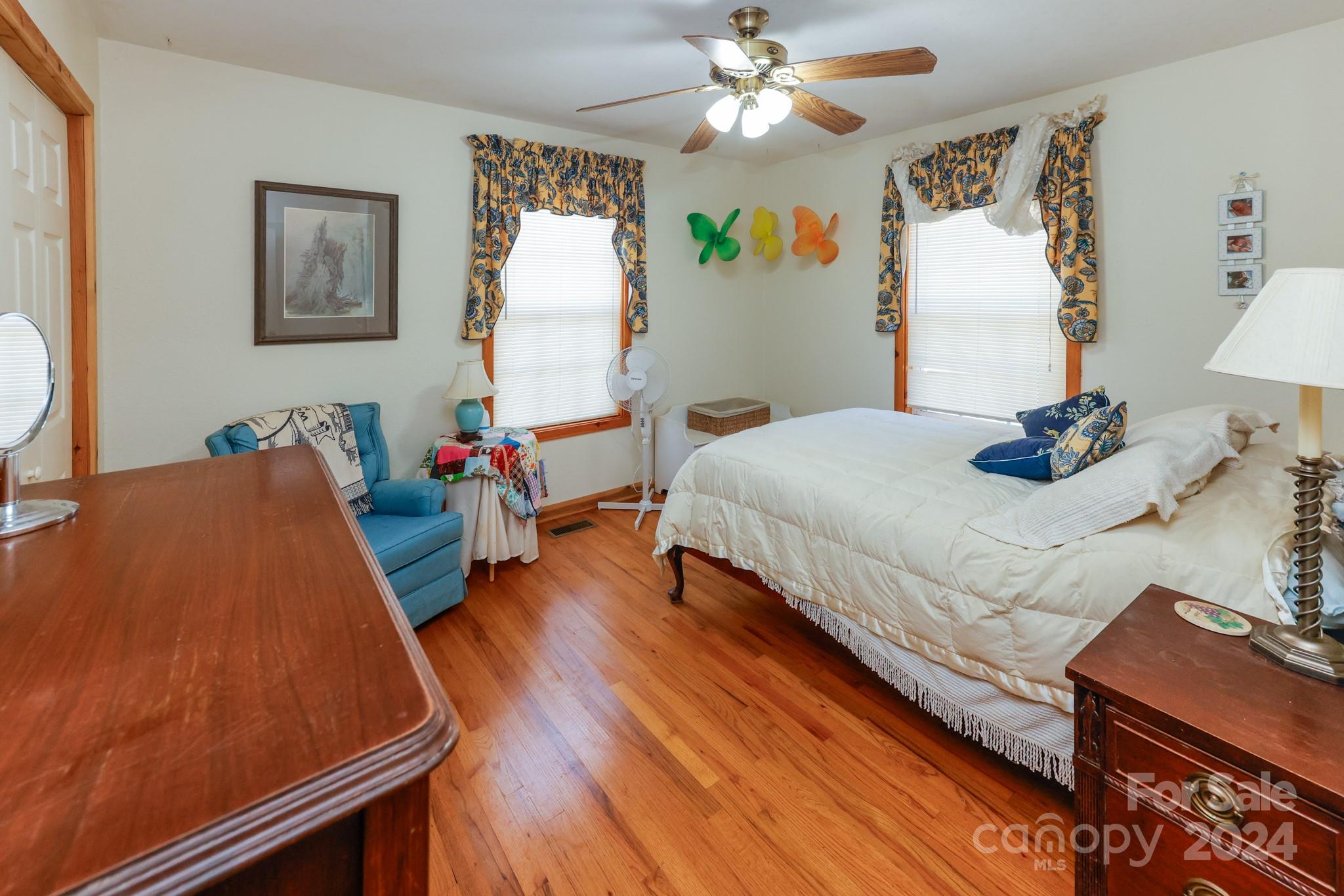 43 Goldfinch Ln Mill Spring Mill Spring, NC 28756 - Photo 14 of 32 a bed room with a bed window and a chair