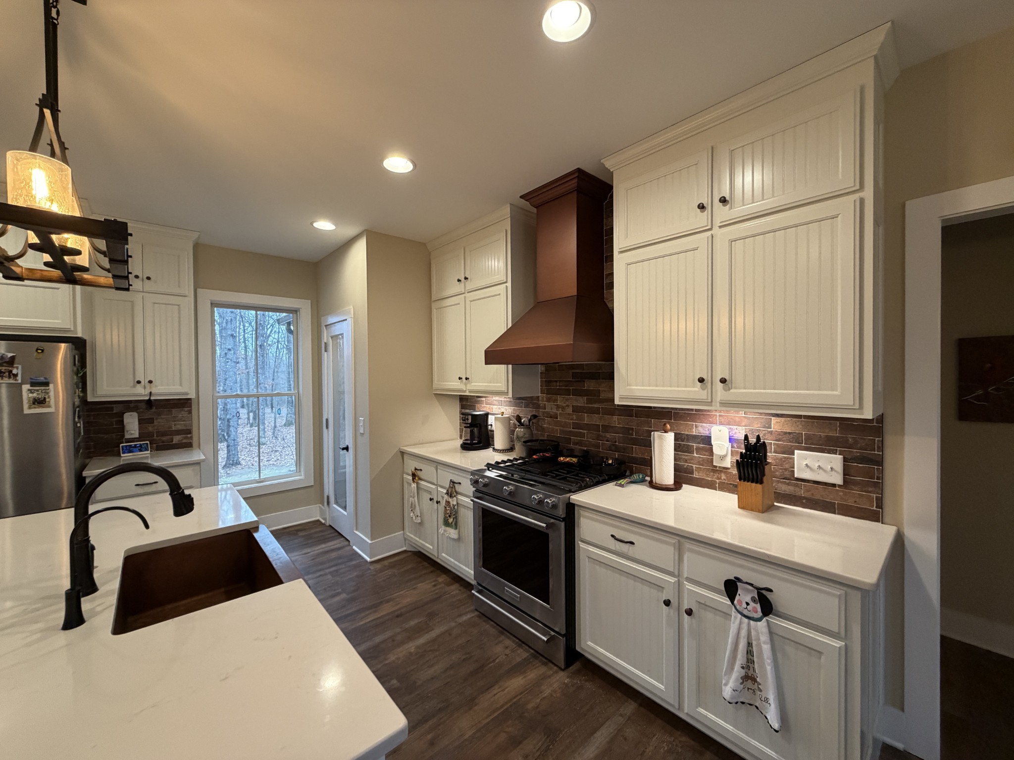 2095 Lake Louisa Loop Monteagle, TN 37356 - Photo 11 of 48 a kitchen with granite countertop a sink stainless steel appliances and cabinets