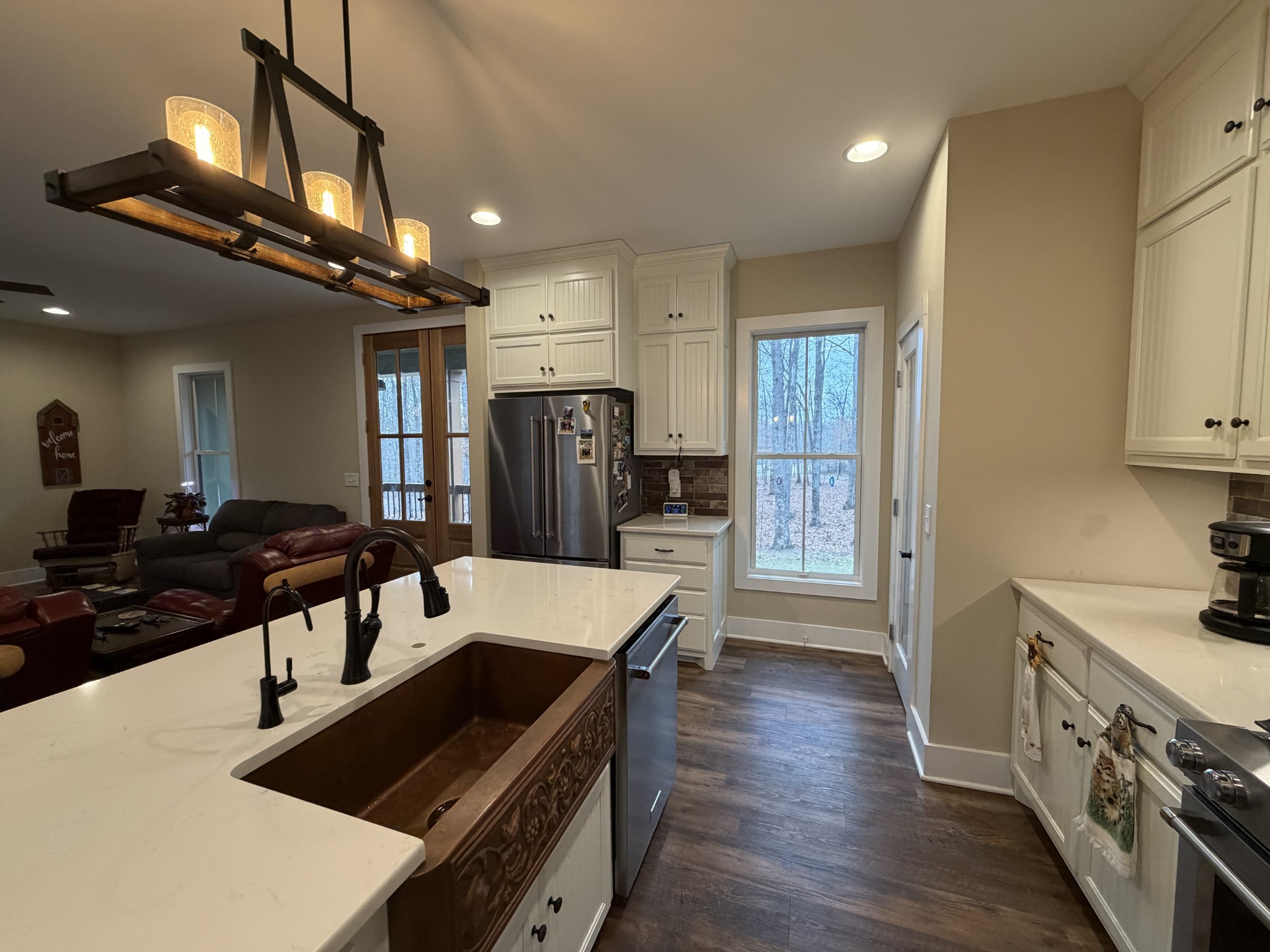 2095 Lake Louisa Loop Monteagle, TN 37356 - Photo 3 of 48 a kitchen with stainless steel appliances a sink a stove a refrigerator cabinets and wooden floor