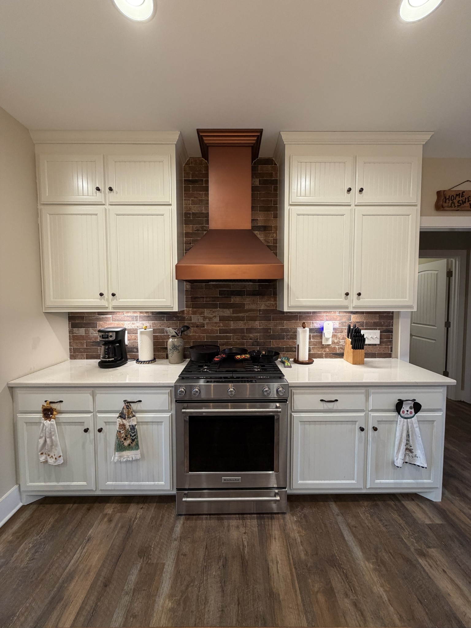 2095 Lake Louisa Loop Monteagle, TN 37356 - Photo 4 of 48 a kitchen with stainless steel appliances granite countertop a stove a sink and white cabinets