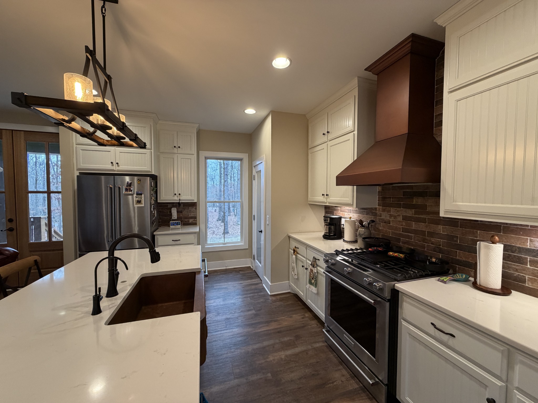 2095 Lake Louisa Loop Monteagle, TN 37356 - Photo 10 of 48 a kitchen with stainless steel appliances a sink stove and refrigerator