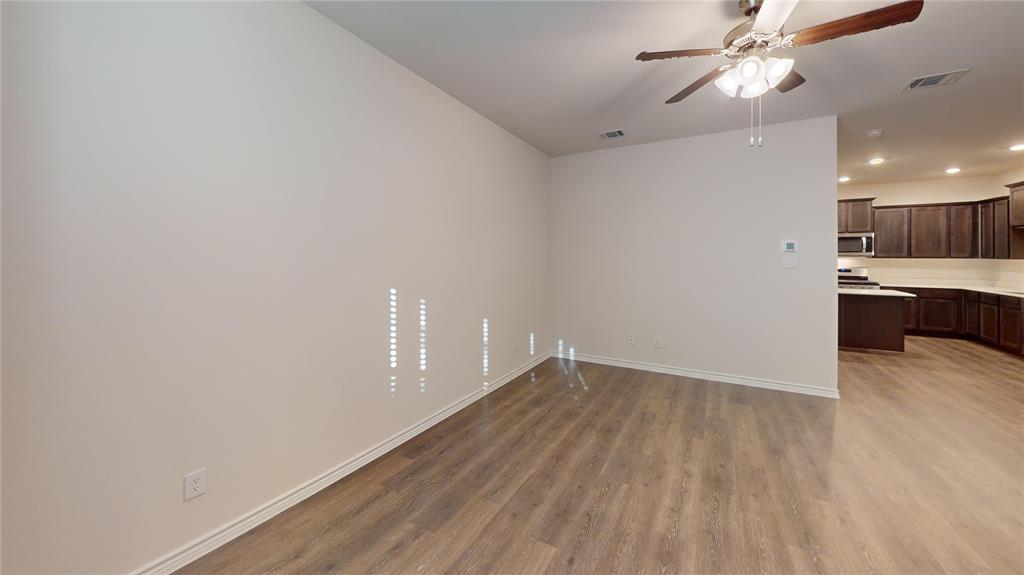 2024 Juniper Pass Way Mesquite, TX 75149 - Photo 12 of 17 wooden floor in an empty room with a window