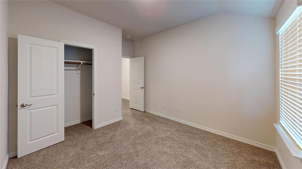 2024 Juniper Pass Way Mesquite, TX 75149 - Photo 4 of 17 an empty room with windows and closet