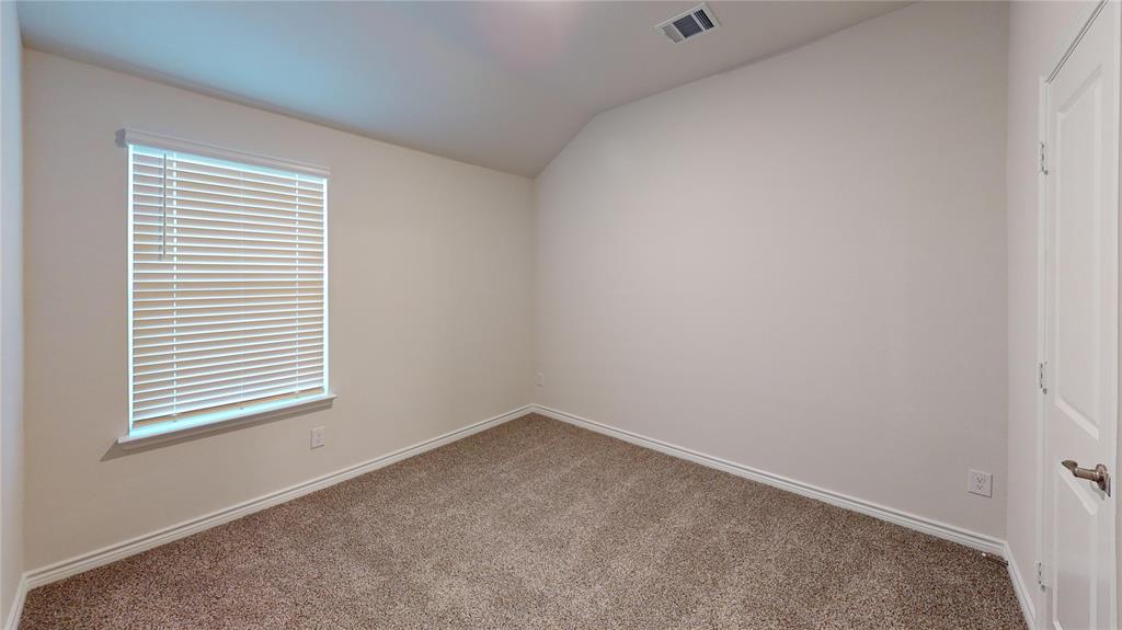 2024 Juniper Pass Way Mesquite, TX 75149 - Photo 7 of 17 an empty room with a window