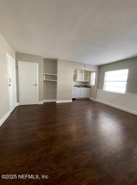 810 2nd Street North, Unit C Jacksonville Beach, FL 32250 - Photo 11 of 17 a view of empty room with wooden floor and fan