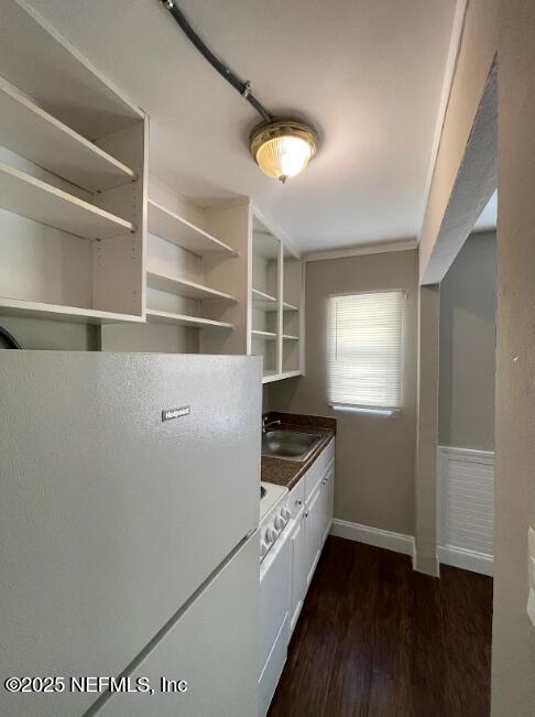810 2nd Street North, Unit C Jacksonville Beach, FL 32250 - Photo 13 of 17 a kitchen with granite countertop a stove and a refrigerator