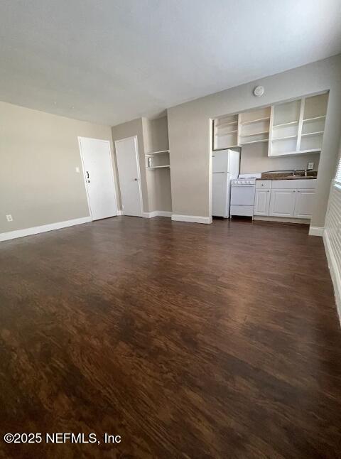 810 2nd Street North, Unit C Jacksonville Beach, FL 32250 - Photo 3 of 17 an empty room with cabinet and mirrors