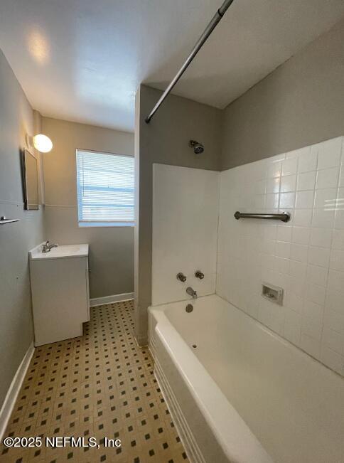 810 2nd Street North, Unit C Jacksonville Beach, FL 32250 - Photo 7 of 17 a bathroom with a bathtub and shower