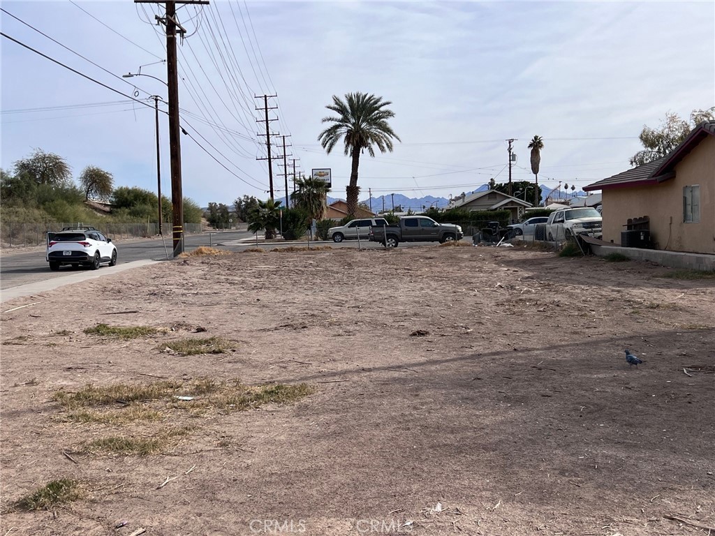 301 South Spring Street Blythe, CA 92225 - Photo 3 of 8 a view of a street with cars on road