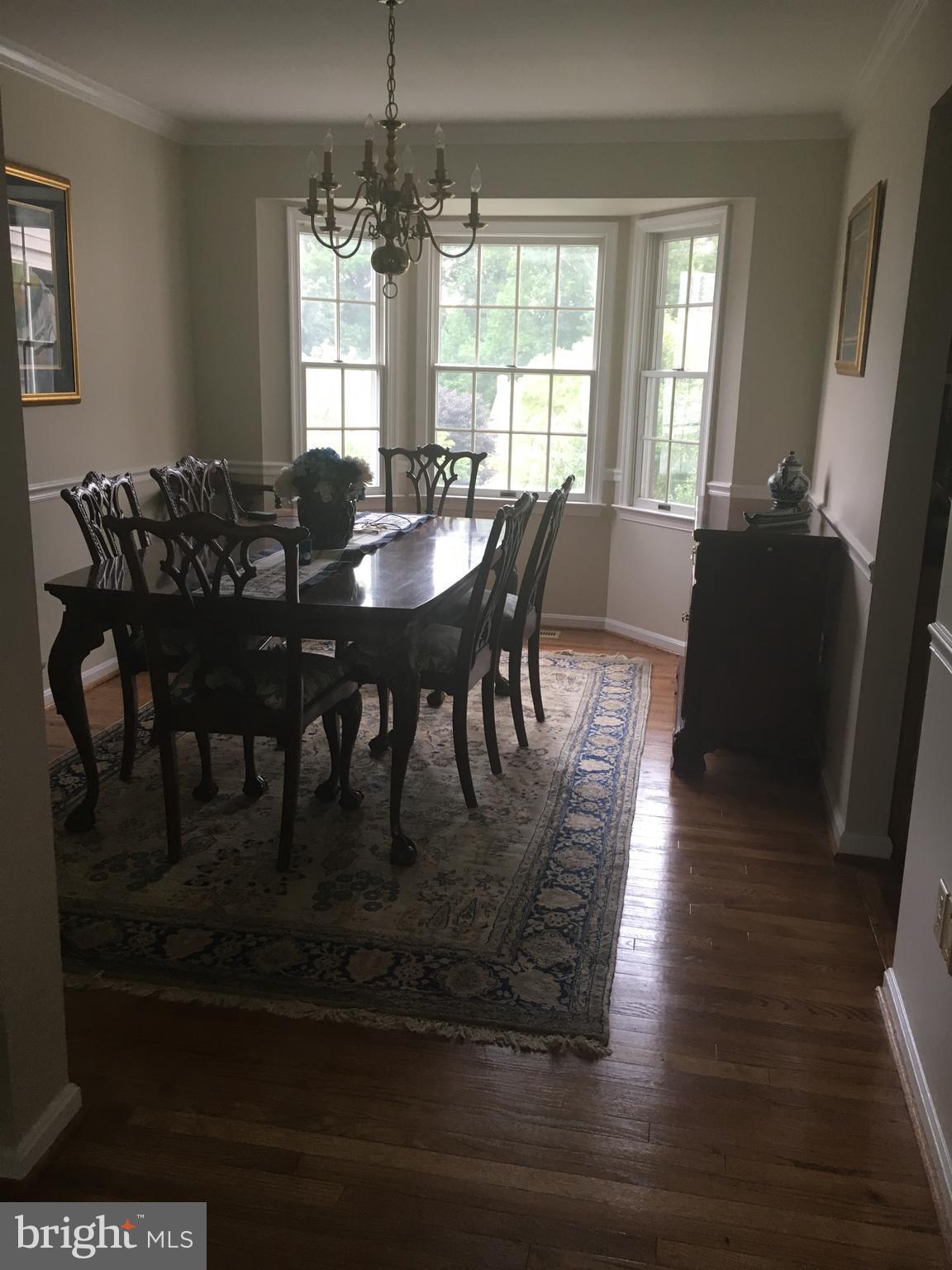 9531 Hallhurst Road Nottingham, MD 21236 - Photo 5 of 30 a view of a dining room with furniture window and wooden floor