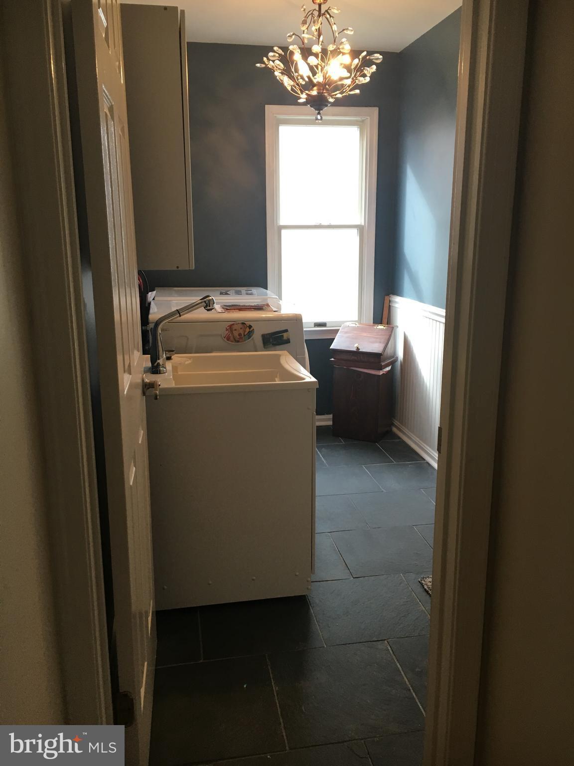 9531 Hallhurst Road Nottingham, MD 21236 - Photo 9 of 30 a view of bathroom with window and wooden floor