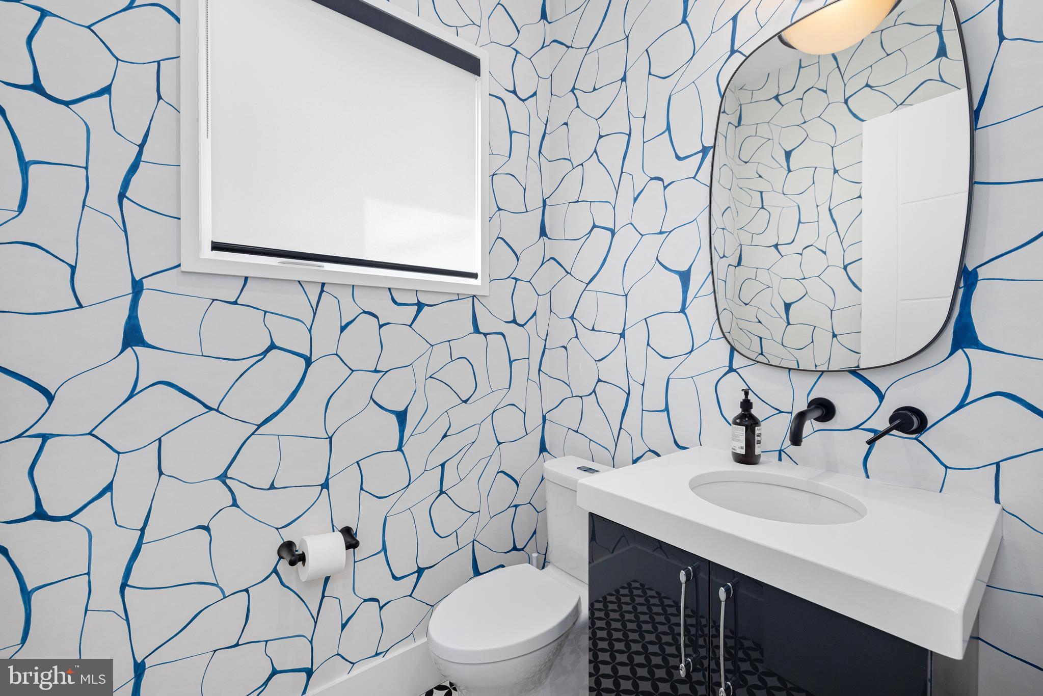 5624 Sherier Place Northwest Washington, DC 20016 - Photo 23 of 60 a bathroom with a sink and a toilet