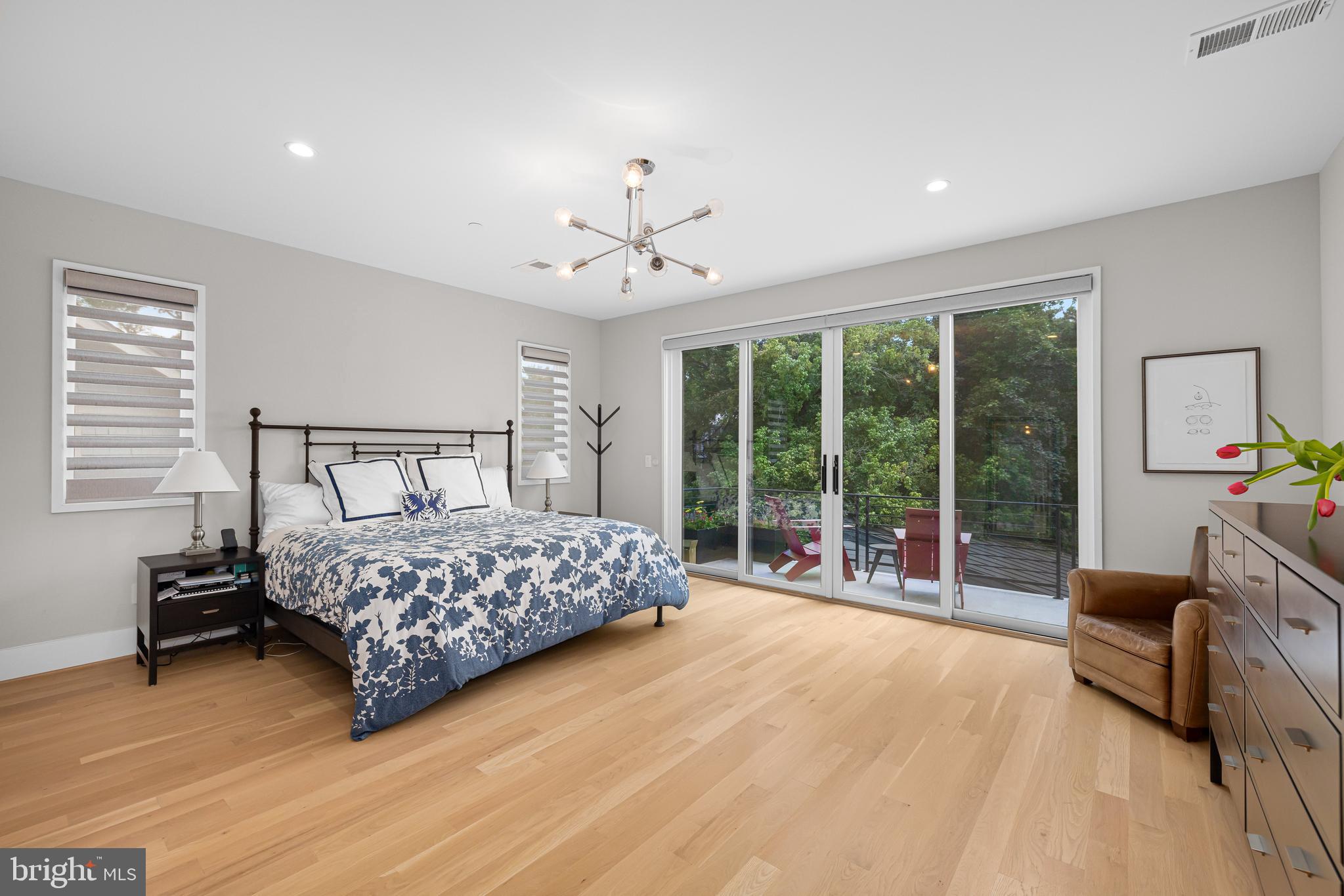 5624 Sherier Place Northwest Washington, DC 20016 - Photo 27 of 60 a bedroom with a bed and a large window