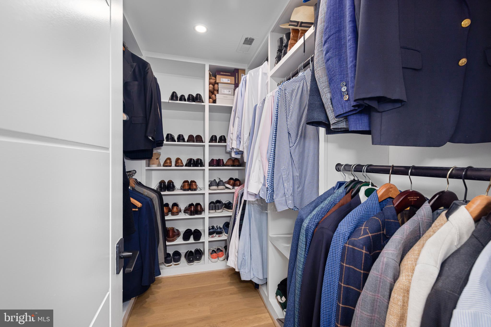 5624 Sherier Place Northwest Washington, DC 20016 - Photo 31 of 60 a view of walk in closet with clothes and shoes