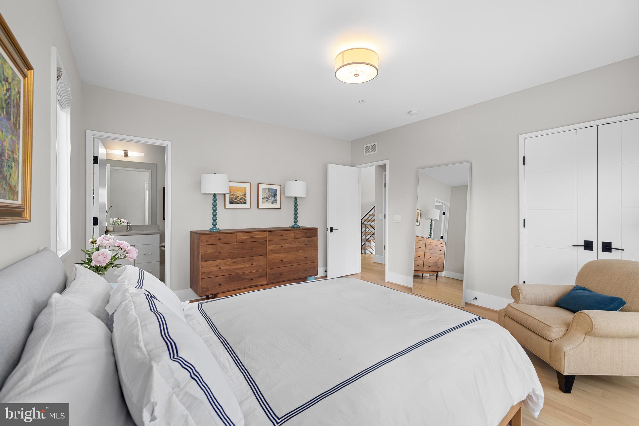 5624 Sherier Place Northwest Washington, DC 20016 - Photo 37 of 60 a bedroom with a bed and a couch