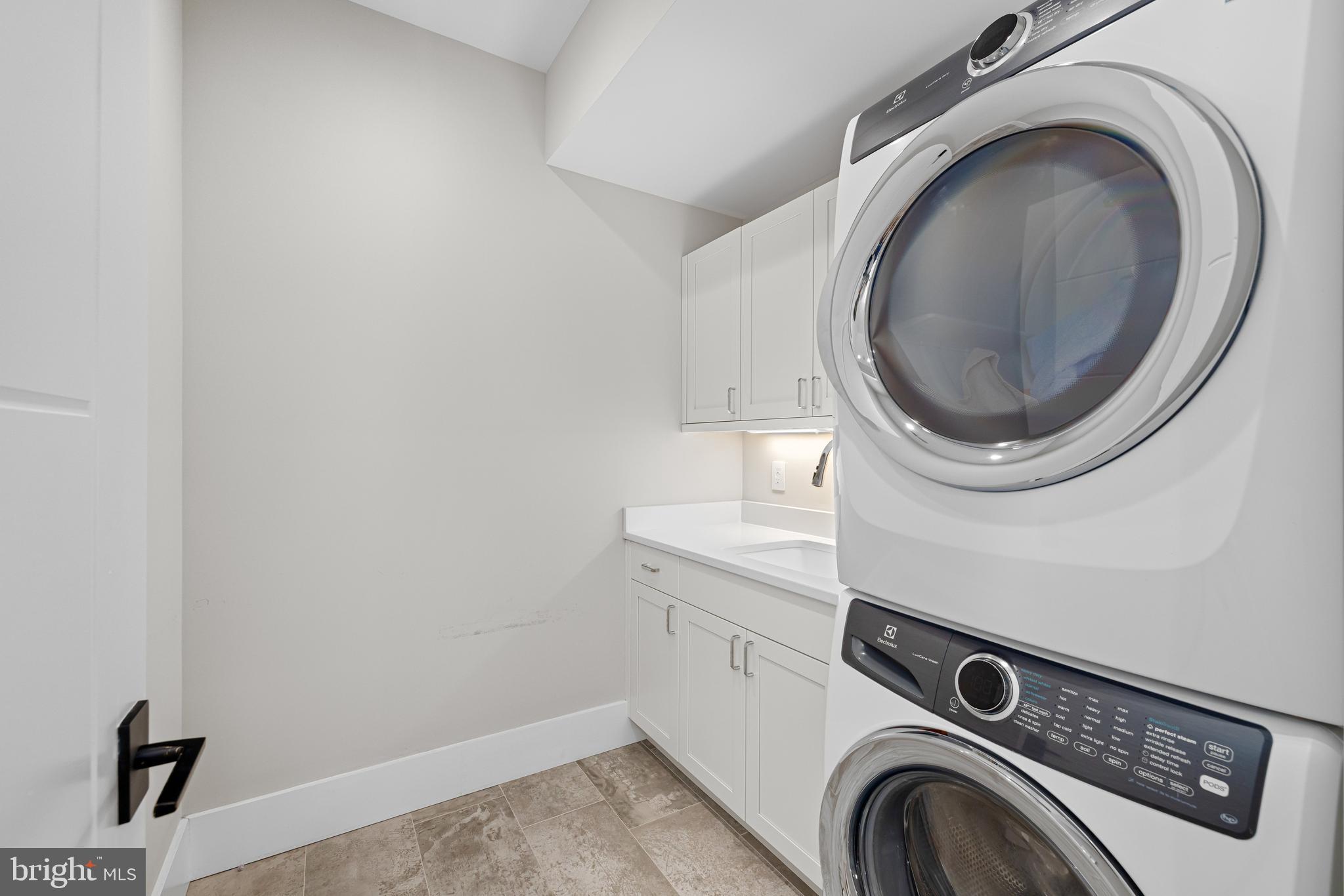 5624 Sherier Place Northwest Washington, DC 20016 - Photo 41 of 60 a utility room with dryer and washer