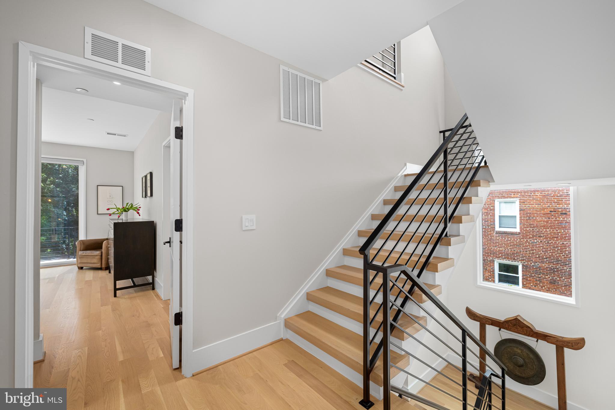 5624 Sherier Place Northwest Washington, DC 20016 - Photo 42 of 60 a view of entryway and hall with wooden floor