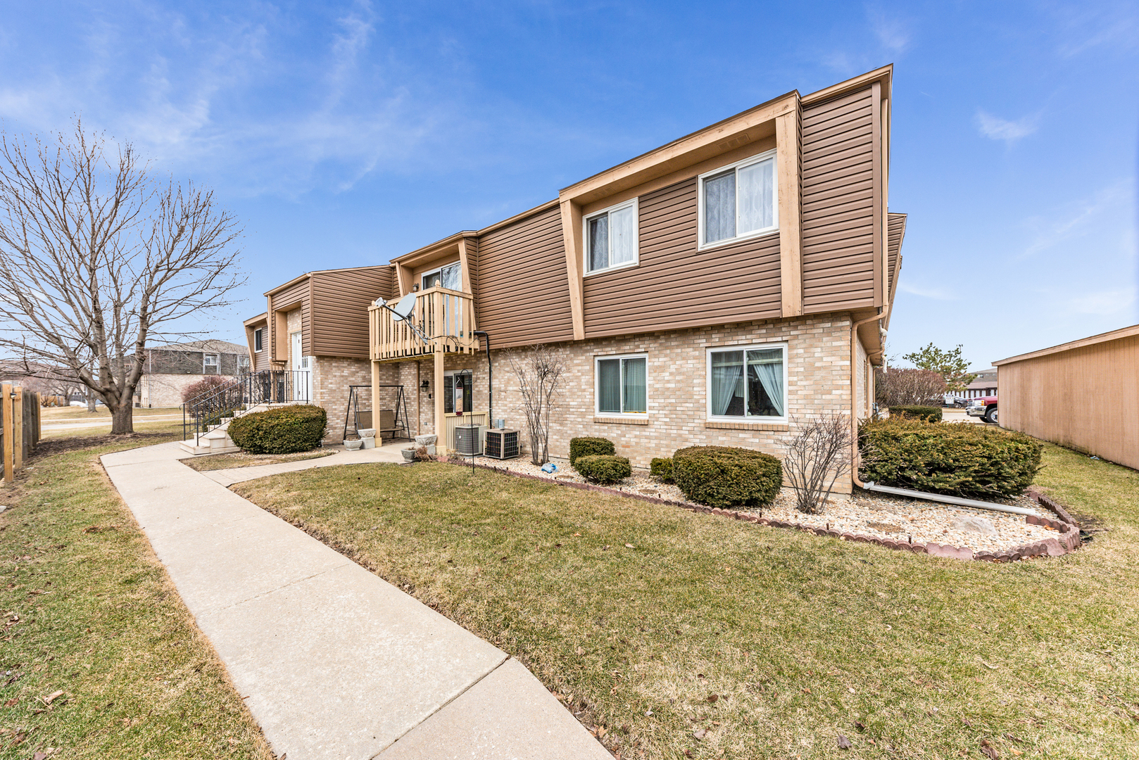 2291 Bicentennial Avenue, Unit 7 Crest Hill, IL 60403 - Photo 14 of 14 a front view of a house with a yard