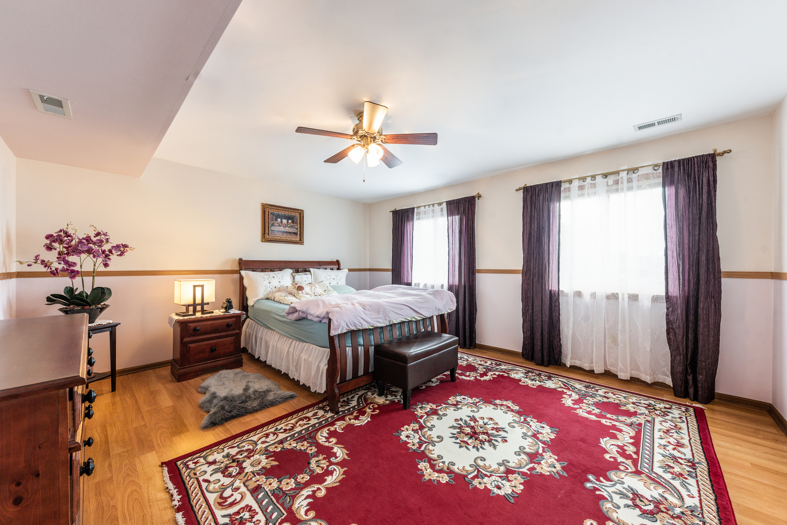 2291 Bicentennial Avenue, Unit 7 Crest Hill, IL 60403 - Photo 5 of 14 a spacious bedroom with a bed and wooden floor