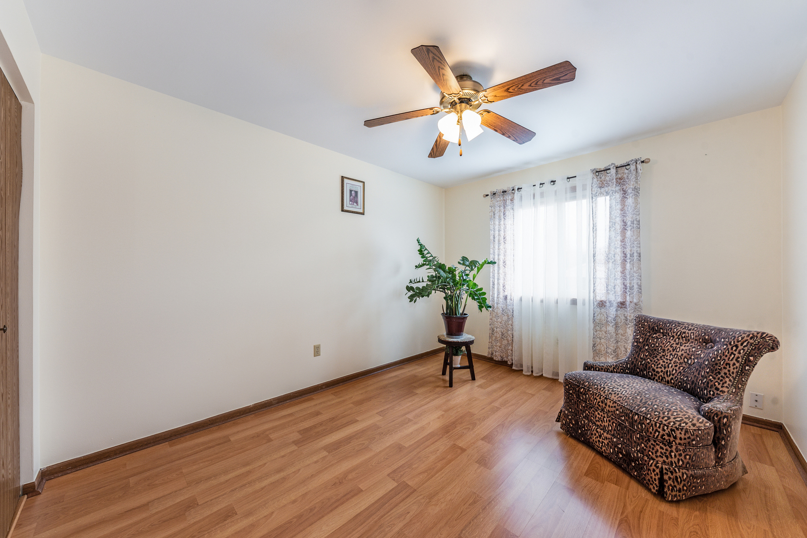 2291 Bicentennial Avenue, Unit 7 Crest Hill, IL 60403 - Photo 7 of 14 a living room with furniture and a ceiling fan