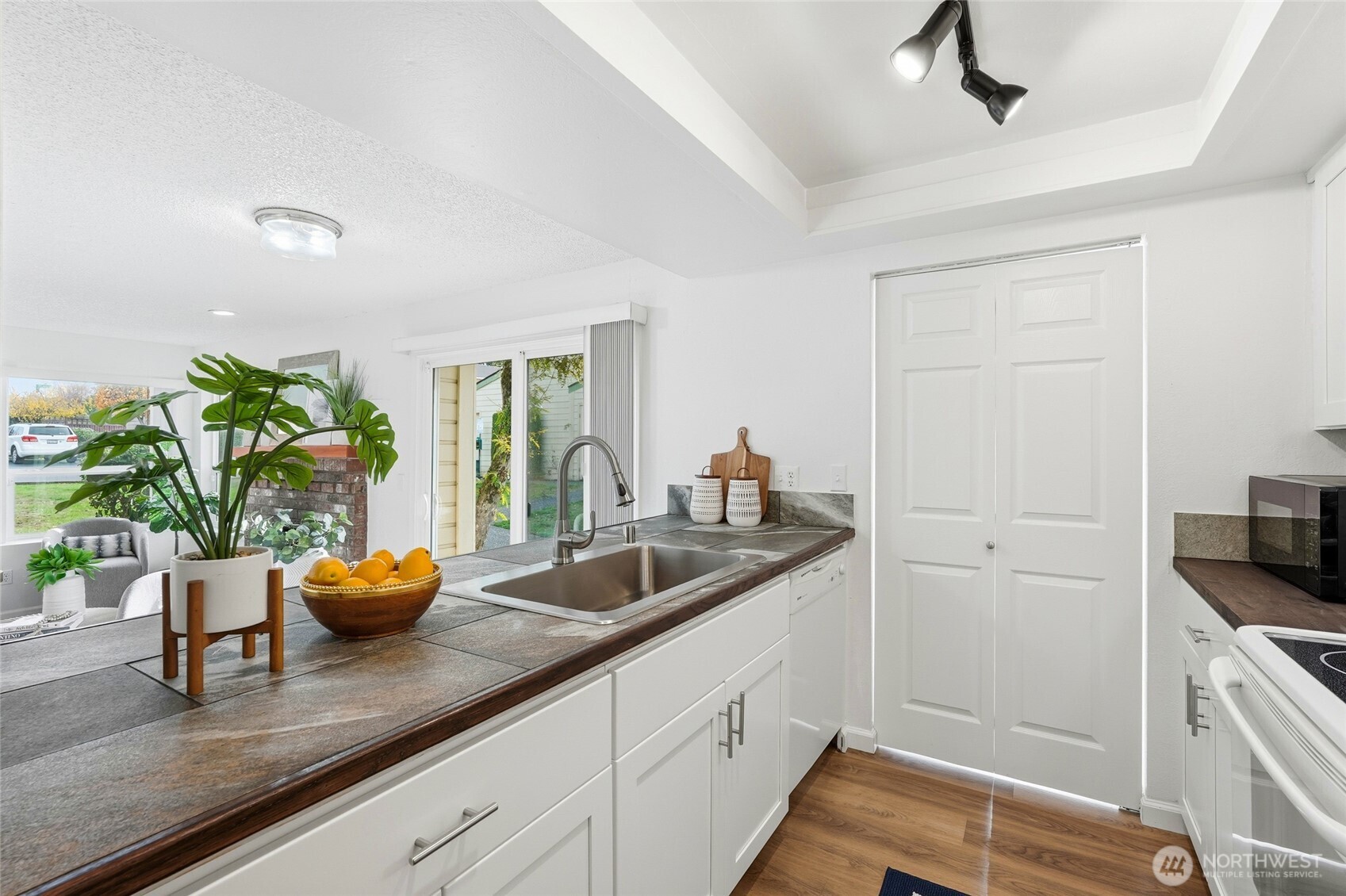 23601 112th Avenue Southeast, Unit A103 Kent, WA 98031 - Photo 13 of 26 a kitchen with sink and potted plant
