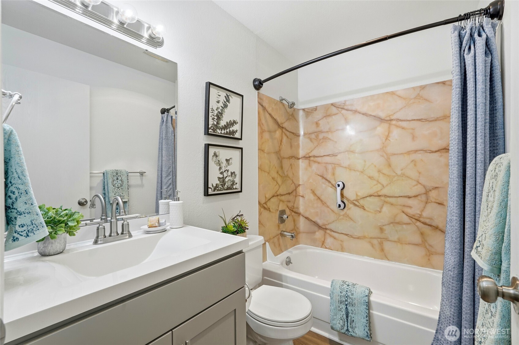 23601 112th Avenue Southeast, Unit A103 Kent, WA 98031 - Photo 21 of 26 a bathroom with a sink a toilet and shower