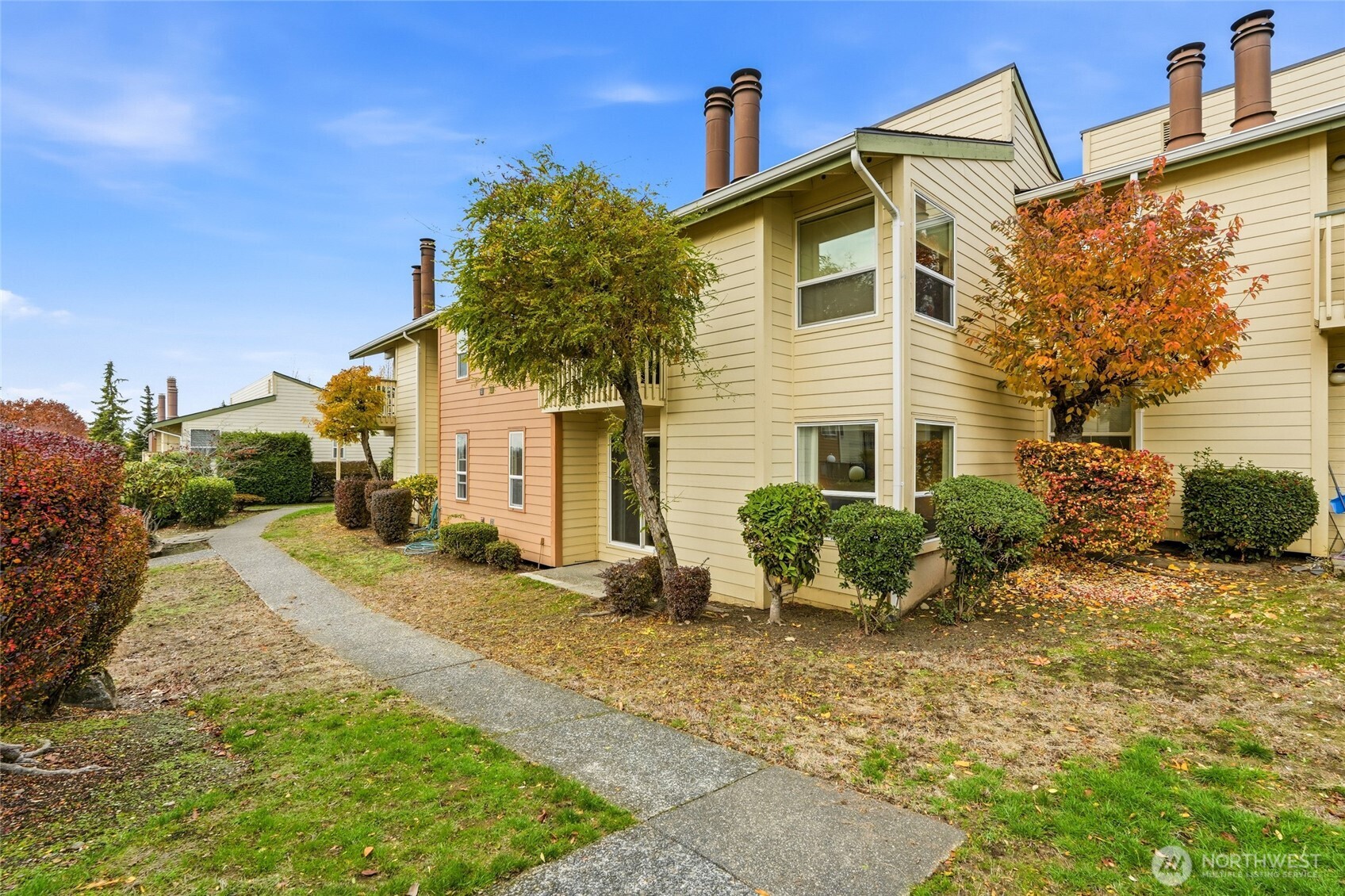 23601 112th Avenue Southeast, Unit A103 Kent, WA 98031 - Photo 22 of 26 a front view of a house with a yard