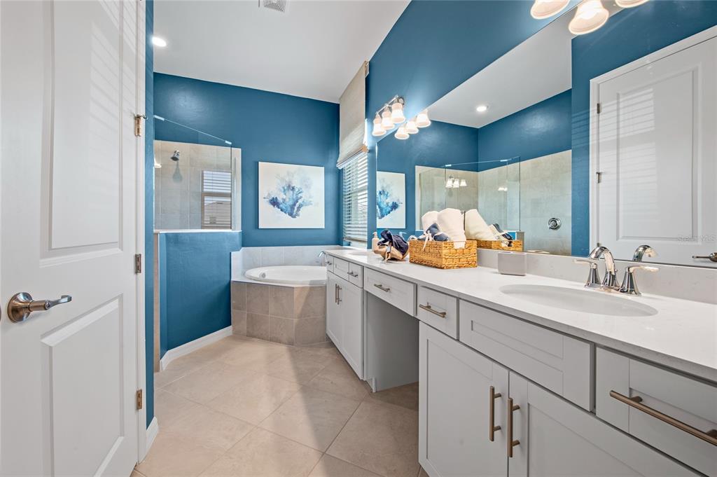 7161 Inlet Isles Lakewood Ranch, FL 34202 - Photo 19 of 29 a bathroom with a double vanity sink mirror and toilet