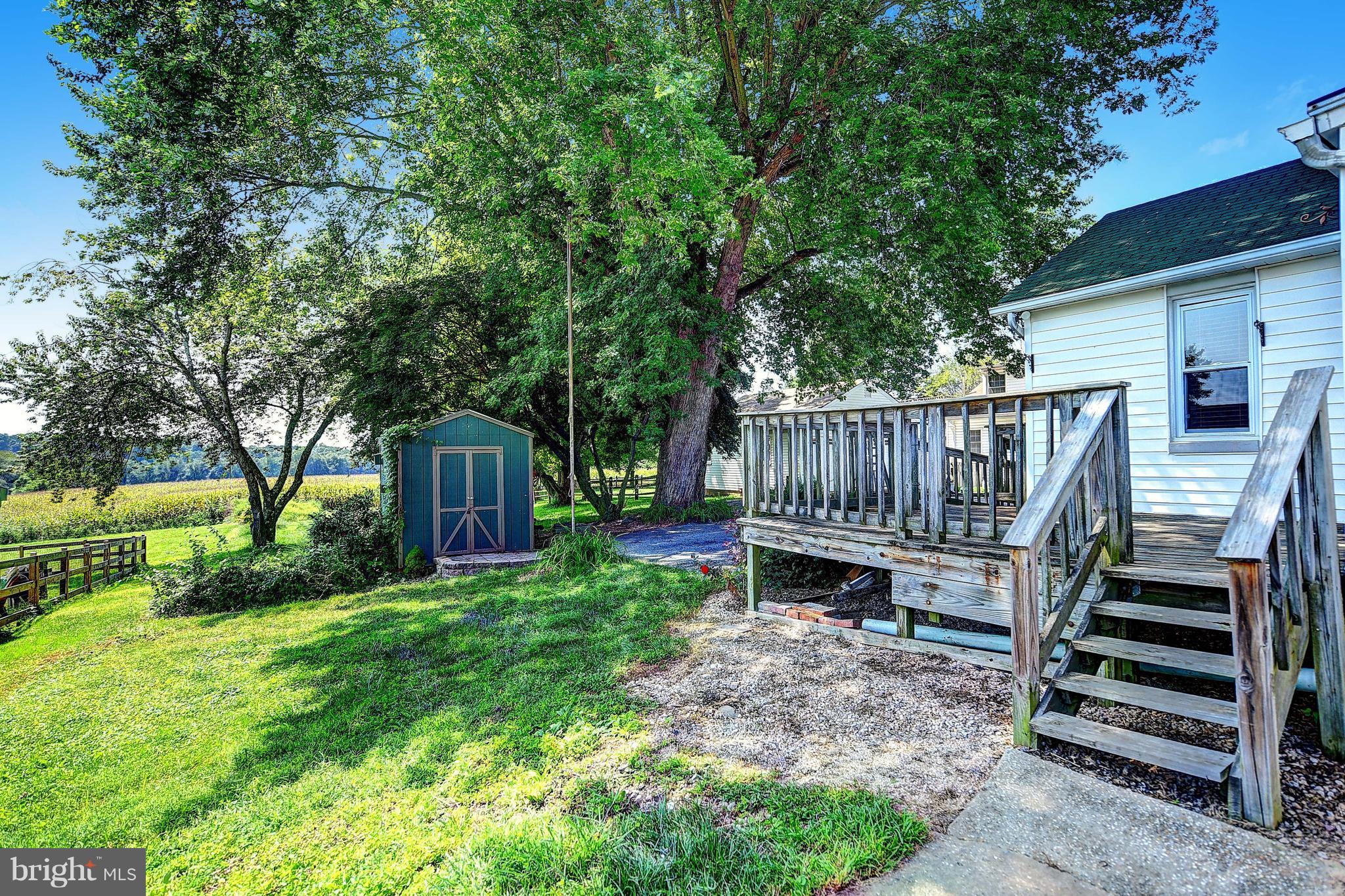 3207 Mt Carmel Road Upperco, MD 21155 - Photo 22 of 30 a view of backyard with deck and garden