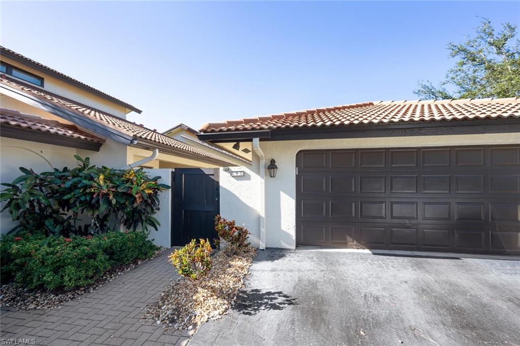 640 Augusta Boulevard Naples, FL 34113 - Photo 20 of 29 a front view of a house
