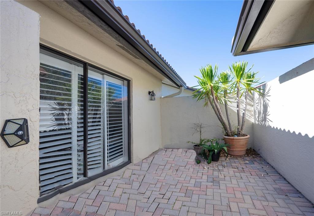 640 Augusta Boulevard Naples, FL 34113 - Photo 22 of 29 a view of a balcony with potted plants