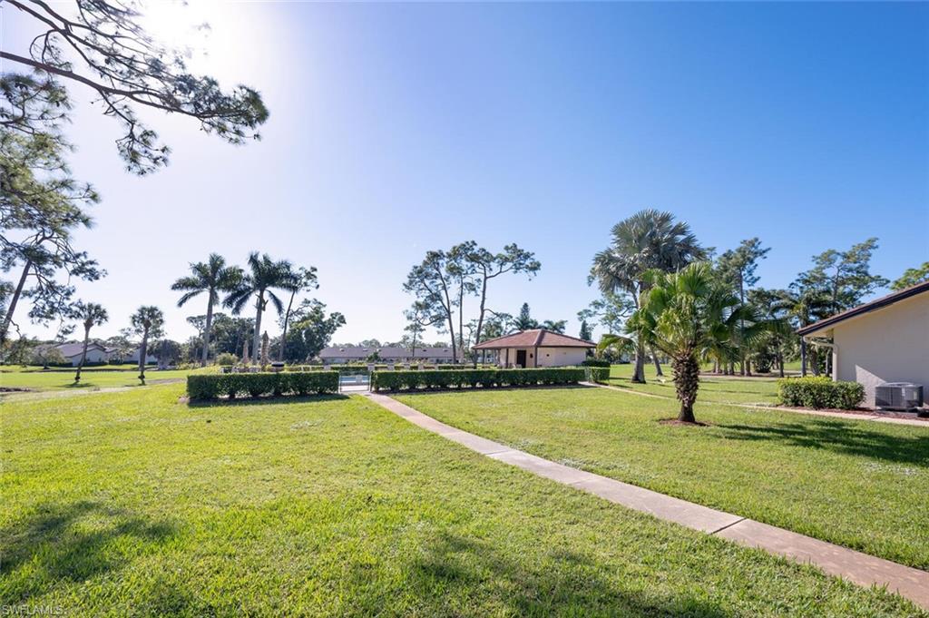 640 Augusta Boulevard Naples, FL 34113 - Photo 23 of 29 a view of a swimming pool and outdoor space
