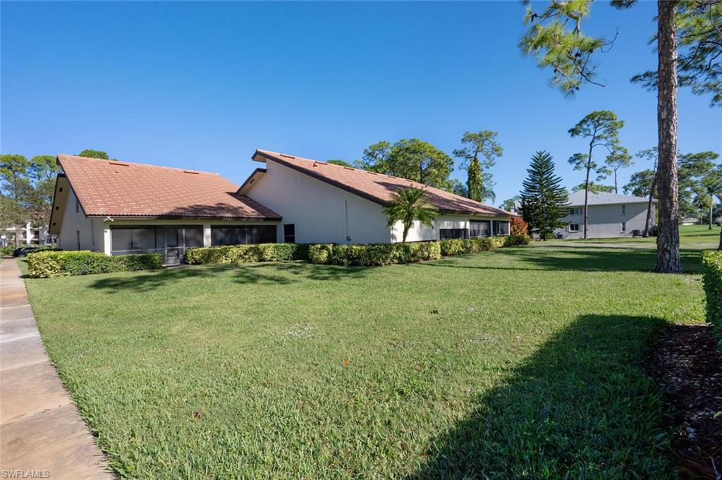 640 Augusta Boulevard Naples, FL 34113 - Photo 27 of 29 a aerial view of a house with garden