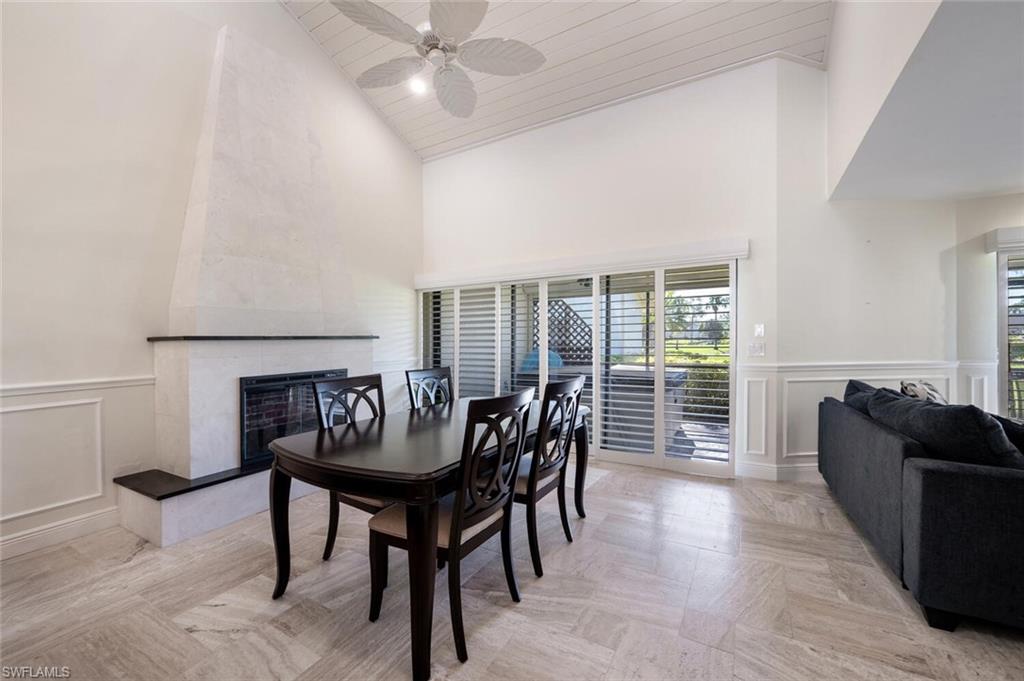 640 Augusta Boulevard Naples, FL 34113 - Photo 6 of 29 a dining room with furniture and wooden floor