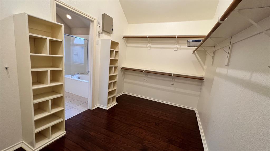 2712 Flint Rock Drive Fort Worth, TX 76131 - Photo 12 of 26 a view of walk in closet with empty racks