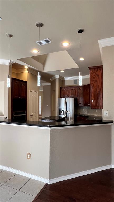 2712 Flint Rock Drive Fort Worth, TX 76131 - Photo 5 of 26 a kitchen with stainless steel appliances granite countertop a sink and cabinets