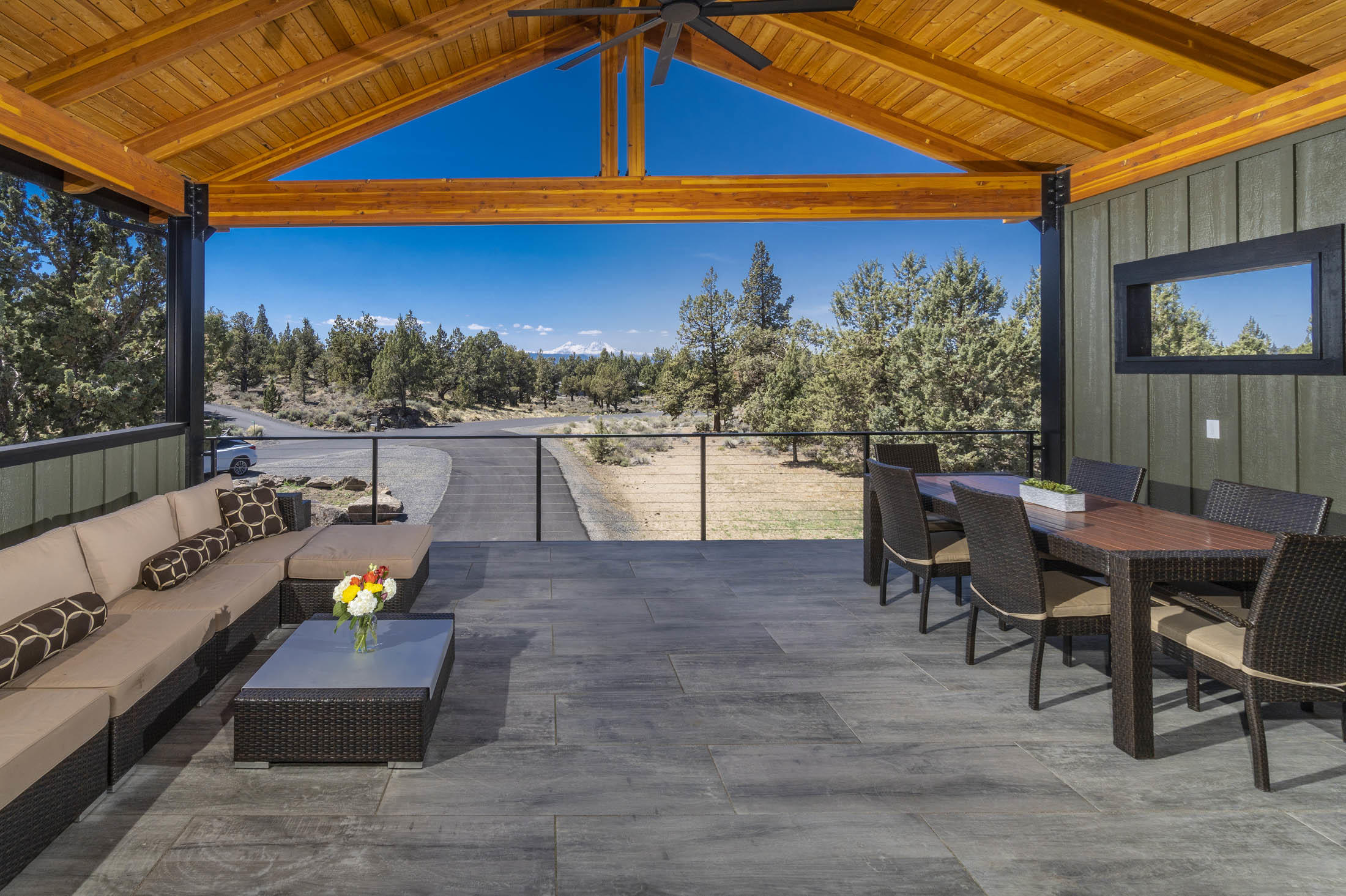 64486 McGrath Road Bend, OR 97701 - Photo 8 of 38 Outdoor balcony with electricity and plumbed for gas fire pit and BBQ. Industrial grade ceiling fan , MSI patio tiles, wired for power screens, speakers wired and installed.