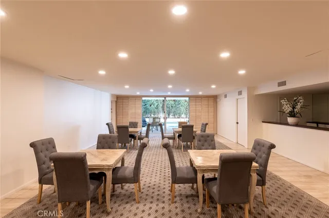 a view of a kitchen with fridge and rack
