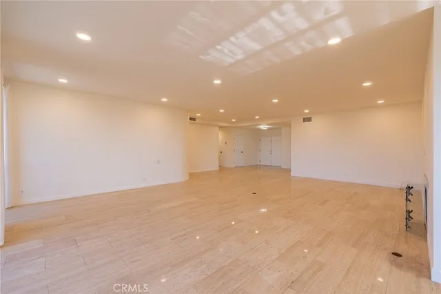 a kitchen with stainless steel appliances granite countertop a stove and a refrigerator