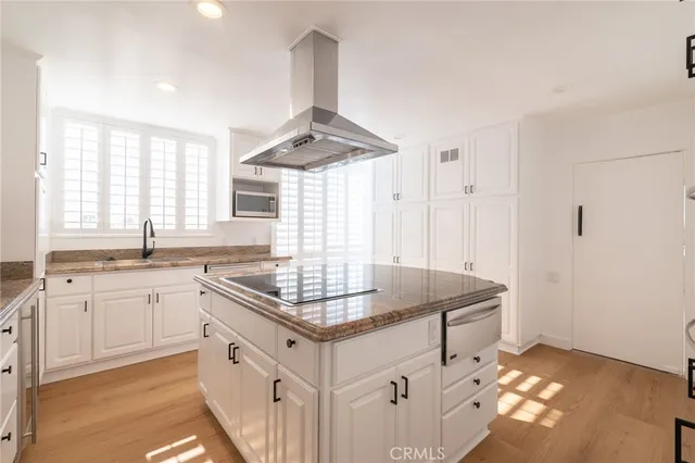 a view of a living room and a balcony
