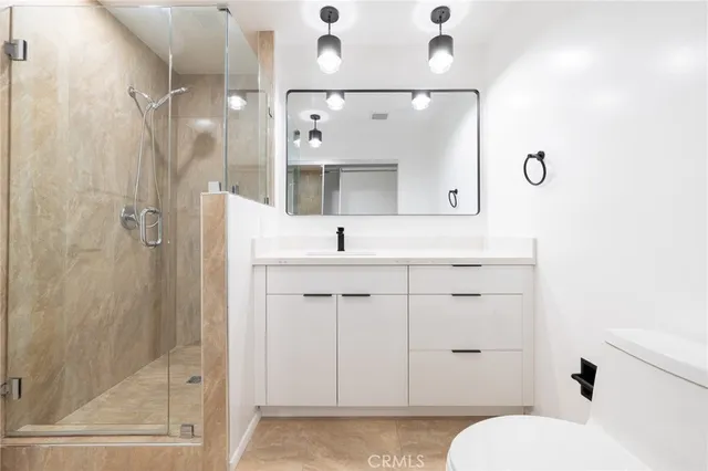 a view of a big room with wooden floor and entrance