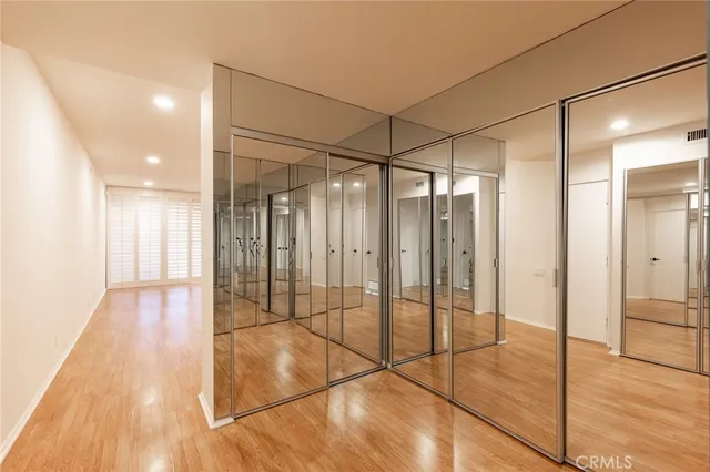 a spacious bathroom with a double vanity sink toilet and shower