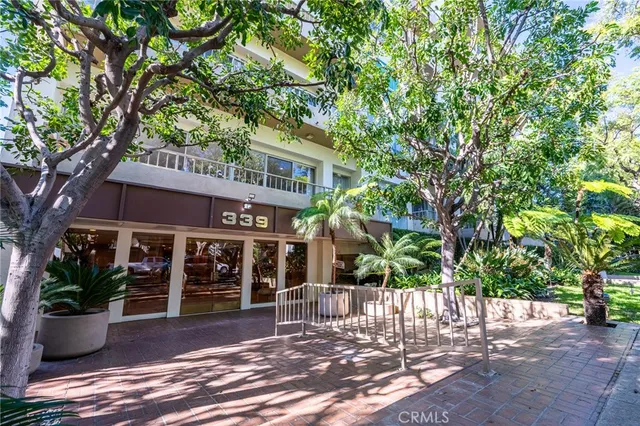 a view of a house with a tree
