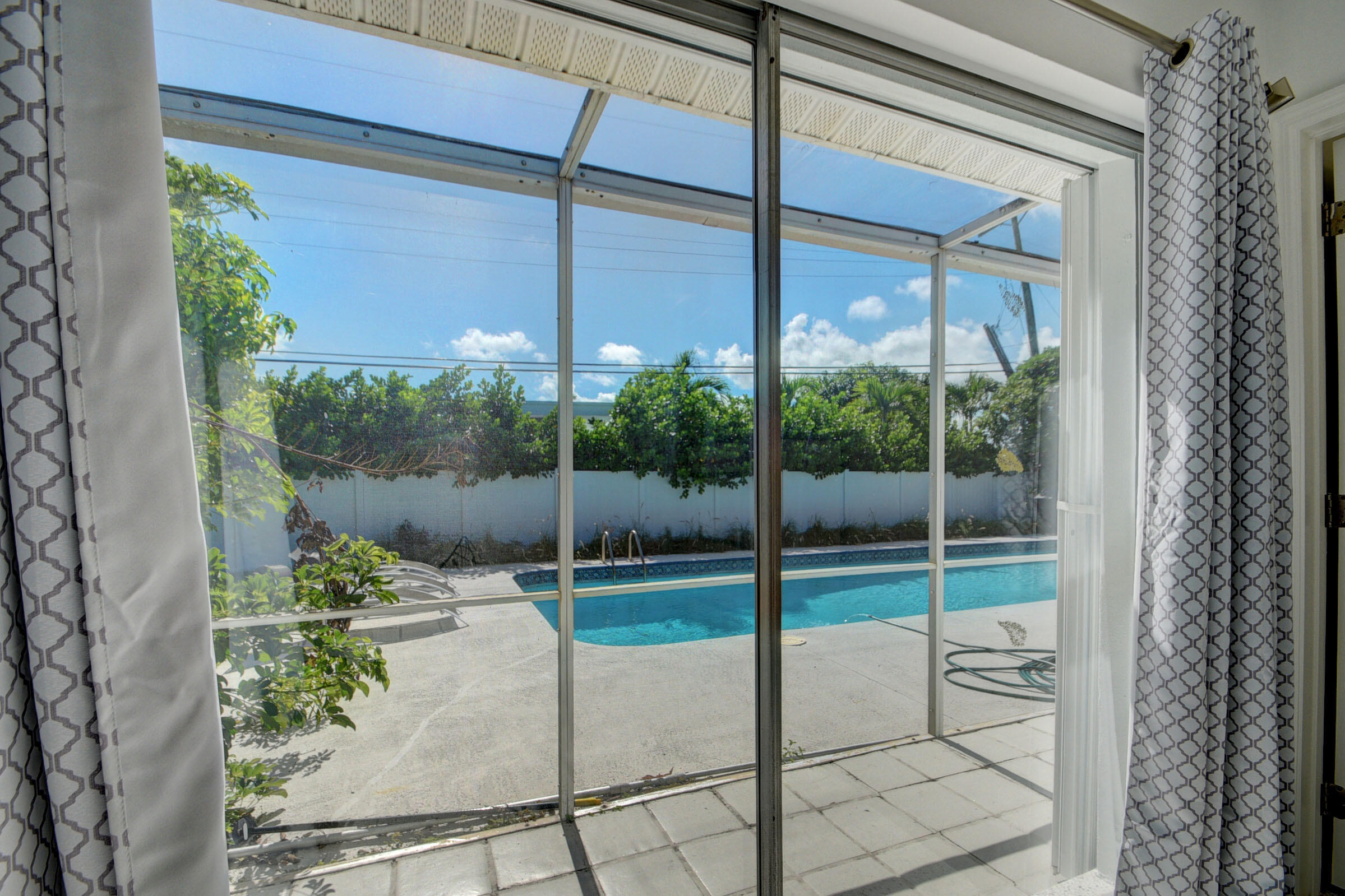 1171 Bimini Lane Singer Island, FL 33404 - Photo 12 of 61 a glass door with outdoor space