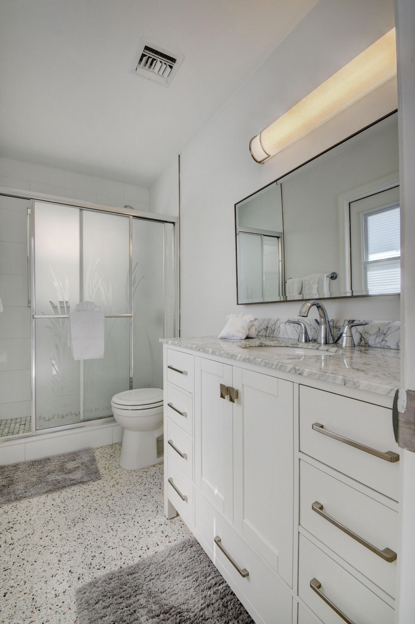 1171 Bimini Lane Singer Island, FL 33404 - Photo 23 of 61 a bathroom with a sink a toilet and shower